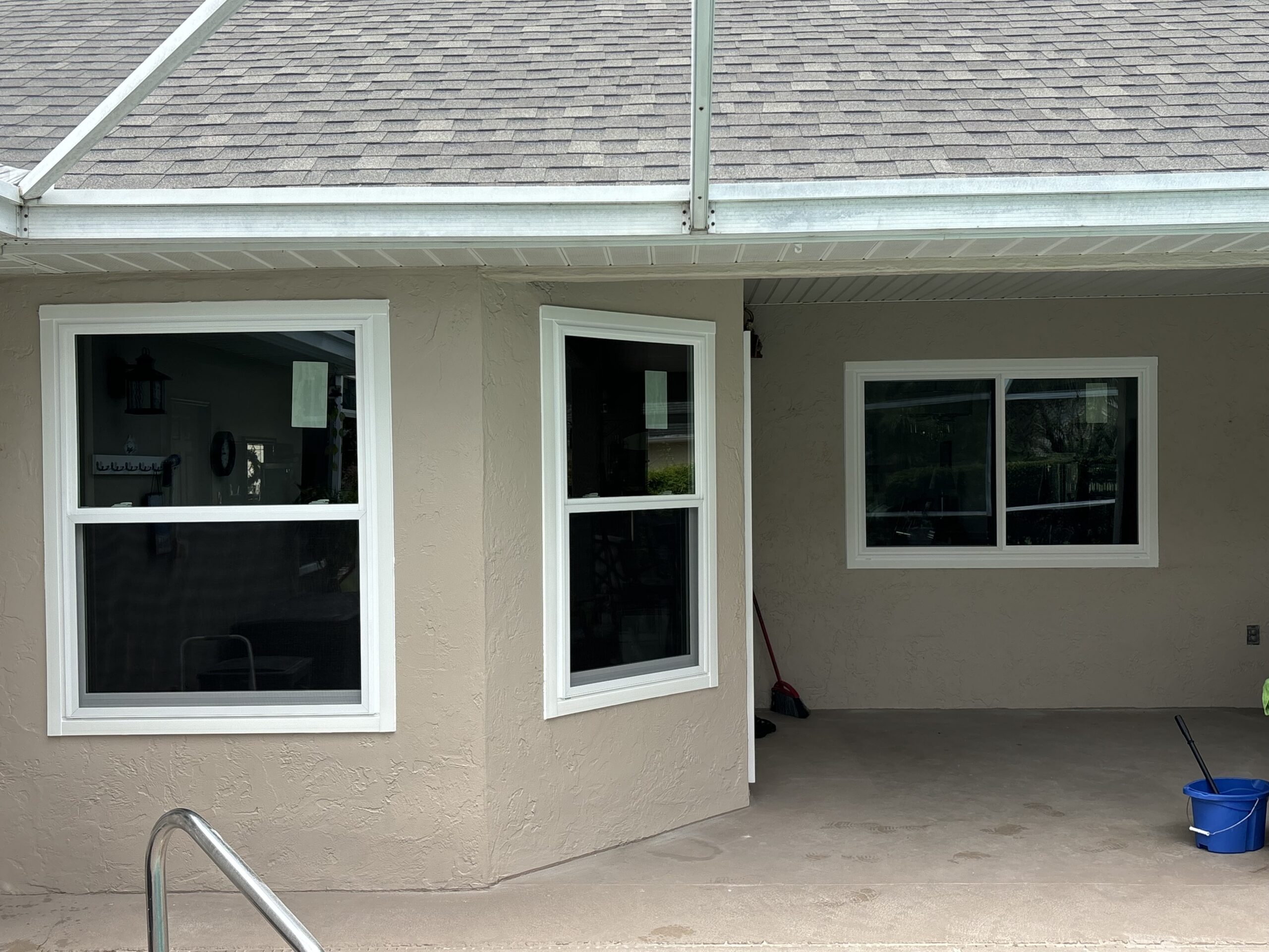 Single hung and slider window replacement under a covered lanai